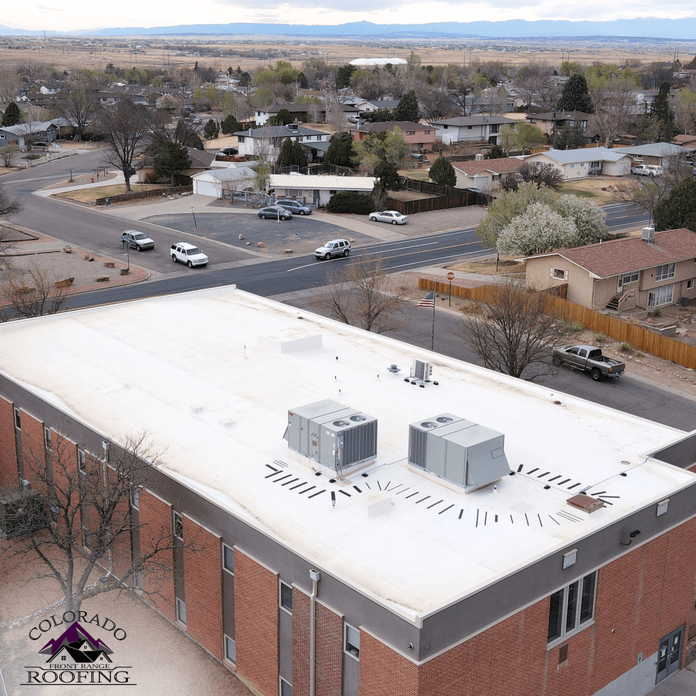 Home with trees and an orange sunset